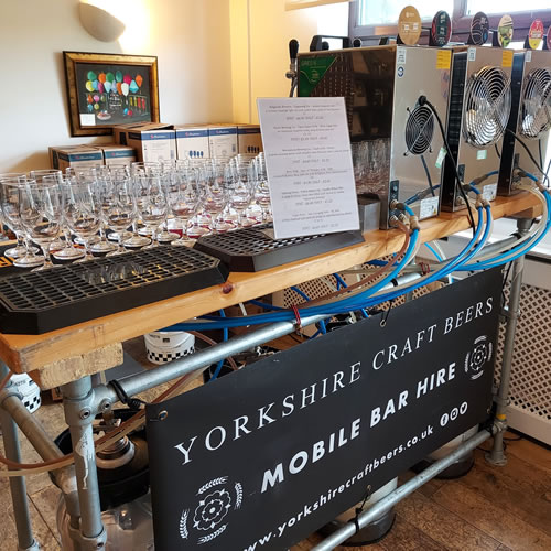 Mobile bar serving craft beer to customers at a corporate event