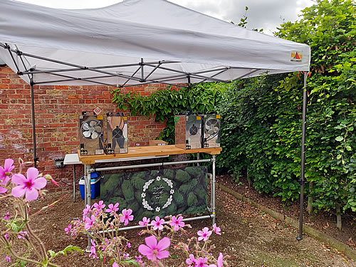 Mobile wedding bar at Newby Hall serving a selection of craft beers to guests